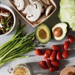 Assorted fresh vegetables and grains for a vibrant, healthy salad.